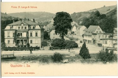 Old photo of Lange and Sohne on yellow paper with red text