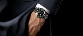Man wearing watch with hand in his pocket